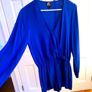 POP of color for a night out. Long sleeve jumpsuit